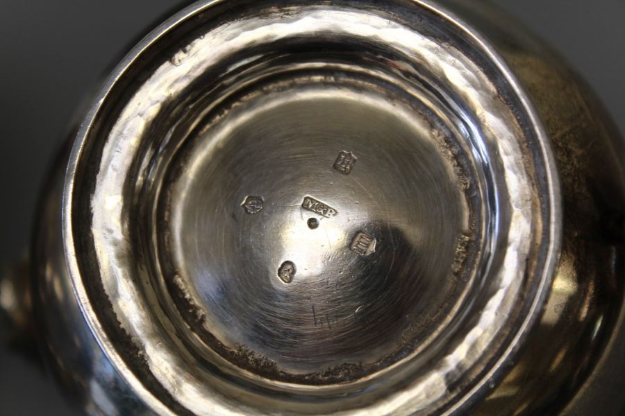 An early 19th century sterling silver footed tea set including bone heat sinks, comprising three - Image 6 of 6