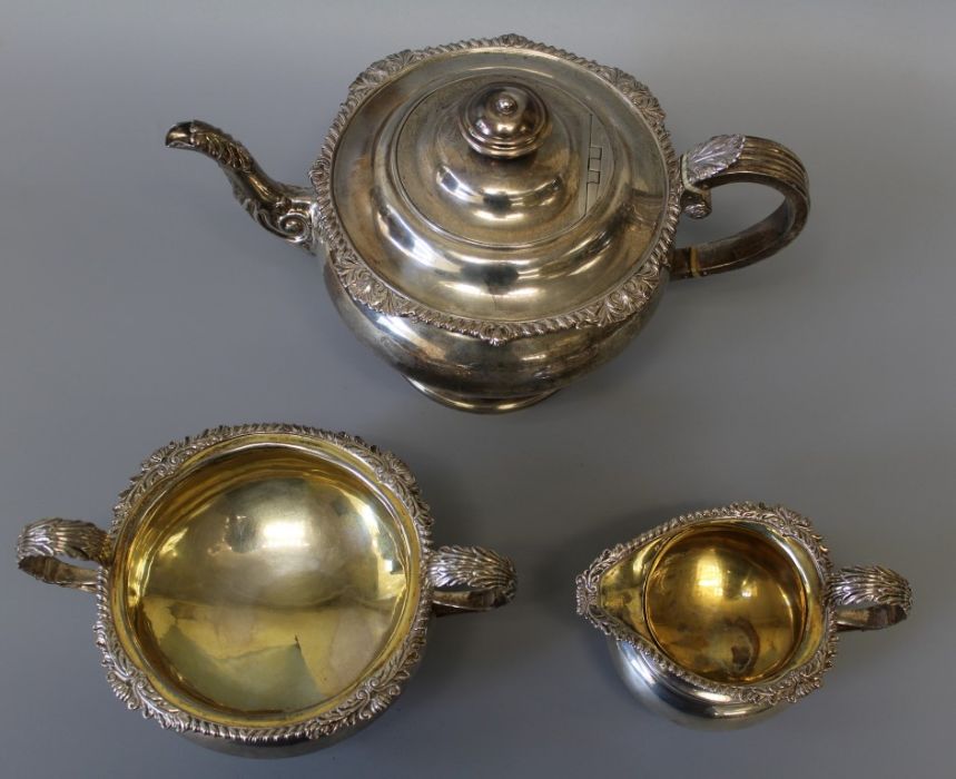 An early 19th century sterling silver footed tea set including bone heat sinks, comprising three - Image 2 of 6