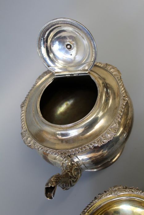An early 19th century sterling silver footed tea set including bone heat sinks, comprising three - Image 3 of 6