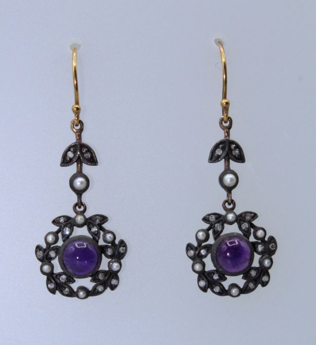 A pair of Victorian style Amethyst, diamond and seed pearl garland drop earrings. In yellow metal