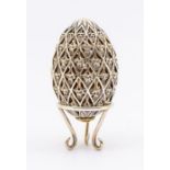 A Modern silver and gilt limited edition Easter Egg, the openwork body with lozenge panels chased