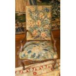 A walnut armchair, c.1730, with needlework covering. On cabriole leg with high quality carving