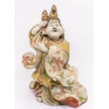 A Japanese Satsuma figure of Okame, enamelled and gilded in flowers, impressed mark, 27.5cm high