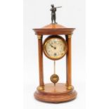 An early 20th century, mahogany, 8-day mantel clock with Arabic numerals and hunter detail to the