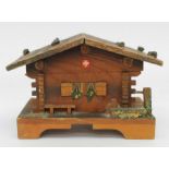 A vintage Swiss Chalet music box entitled Le Vieux Chalet, not working
