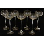 Seven early 20th century tall wine/champagne glasses with grape vine etched glass bowls with