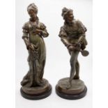 A pair of late 19th century/early 20th century French spelter figures on wooden plinths of