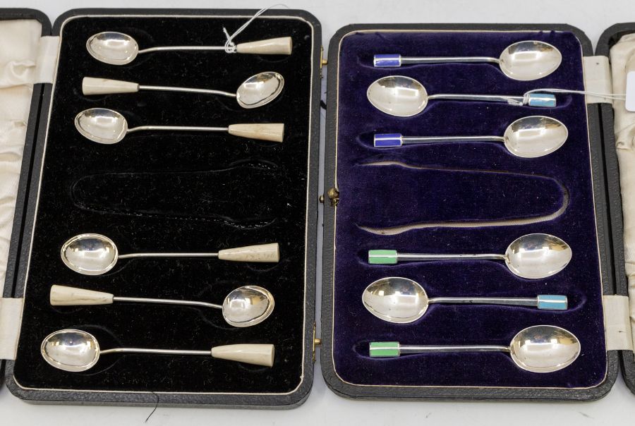 A cased set of six stylised Art Deco style enamelled coffee spoons, hallmarked Birmingham, 1948,