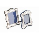 Two silver photo frames to include; A stylised floral Art Nouveau style silver easel form frame with