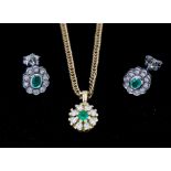 An emerald and diamond flower cluster pendant, the centre set with a round cut emerald, approx