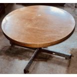 A 20th century oak circular oak coffee table on a chrome frame.