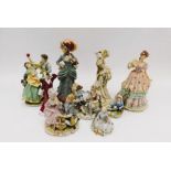 A collection of 20th century figurines, mostly Continental, porcelain and clay