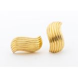 A pair of 9ct gold earrings, comprising a stylized wave design with ridged finish, domed hollow