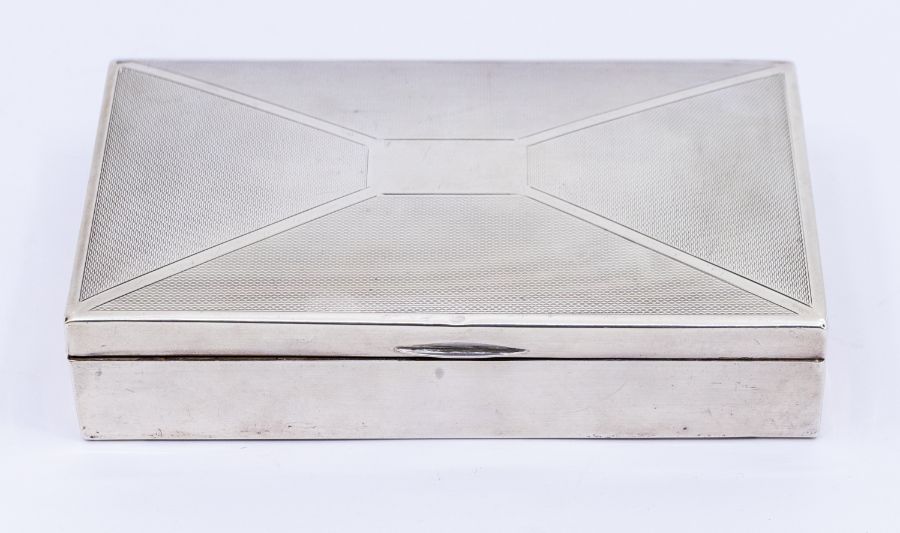 A George VI silver engine turned decorated cigarette box, with wooden interior and leather based,