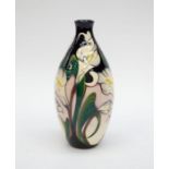 A boxed Moorcroft Pottery vase in 'Calla Lily' vase