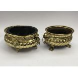 2 19th century brass planters. To include: a profusely repousee decorated example of oval form, with
