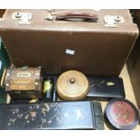 A vintage suitcase, lacquered glove boxes, treen boxes and needle boxes