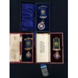 Three silver cased Masonic medals and a choirmaster's medallion