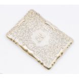 An Edwardian silver card case, engraved and embossed foliate leaf and scrolled decoration, shield