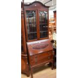 A reproduction mahogany Georgian style bureau bookcase