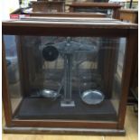 Three early to mid 20th century scales in mahogany and glass cases