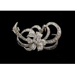 A diamond and platinum floral spray brooch, set with small diamonds, length approx 35mm, total gross