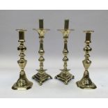 2 pairs of 19th century brass candlesticks. To include: a pair with triangular bases on paw style