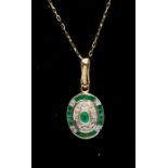 An emerald and diamond 9ct gold pendant, oval form, rub over set to the centre with an oval