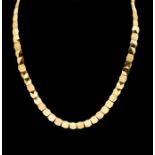 A 9ct gold collarette necklace comprising hexagonal polished faceted and textured link, each