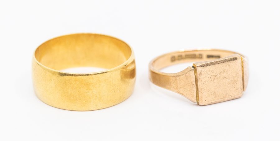 An 18ct gold band, width approx 9mm, width approx Z, weight approx 10gms along with a 9ct gold