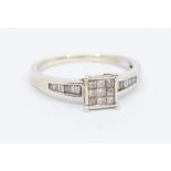 A diamond and 9ct white gold dress ring, comprising a square setting set with nive princess cut