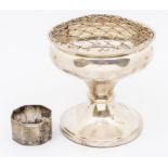 A Queen Elizabeth II filled silver rose bowl on pedestal form fabric based bottom and grate to