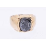 A 9ct gold and carved hematite ring, featuring a centurion, size S, total gross weight approx 6.5gms