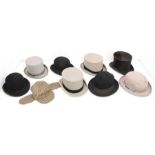 A collection of men's hats to include: three grey top hats; two black bowler hats; a black homburg