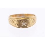 A stone set 14ct gold gents ring, star set to the centre with a small diamond, textured shoulders,