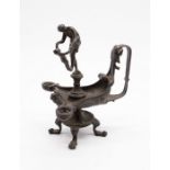 An interesting early 19th century bronze chamberstick with two candle bowls and classical lady and