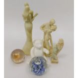 A collection of resin and glass figures including some African