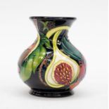 A Moorcroft Pottery boxed miniature vase, 'Queen's Choice' collection