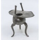 A small metal 20th century Chinese ewer with dragon detail, tripod legs and a Chinese Republic