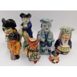 A large collection of mid to late 19th century Staffordshire Toby Jugs - the characters are of the