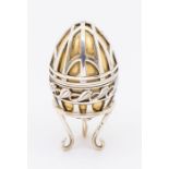 A Modern silver and parcel-gilt limited edition Easter Egg, the gilt body overlaid with silver