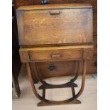 A 1930s' oak ladies bureau with carved front