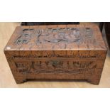 A mid 20th century, heavily carved, Chinese, hardwood, camphor chest