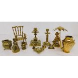 A mixed collection of brass wares to include candlesticks and other decorative brass items.
