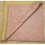 An Italian quilt, part brocade and grosgrain in a dusky pink with silver thread running through
