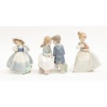 Three Nao figurines of young children