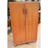 Two teak display cabinets with sliding doors, a teak lowboy, and a teak stereo unit case