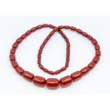 Cherry type necklace, comprising graduated ovoid beads from 12 x 8mm to 28 x 22mm, length approx