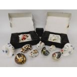 A collection of 12 Royal Crown Derby paperweights: 10 gold stopper and 2 snakes without stoppers (