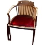 A late Victorian mahogany and bone inlay smokers chair.